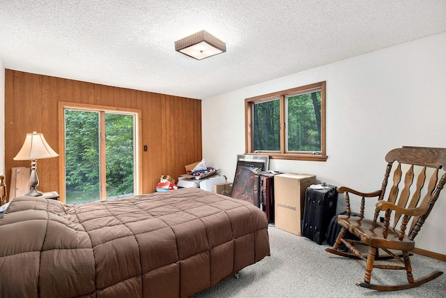 441 N Benson Rd, Fountain, MI 49410 - bedroom featuring wooden walls, light colored carpet, and a textured ceiling