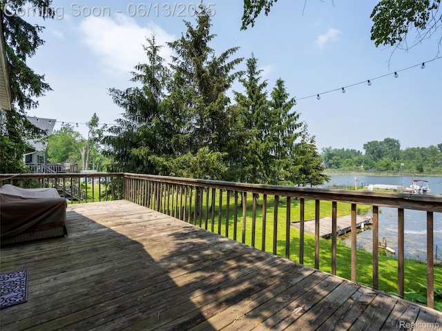 4967 Coshocton Dr, Waterford, MI 48327 - wooden deck featuring a water view and a lawn