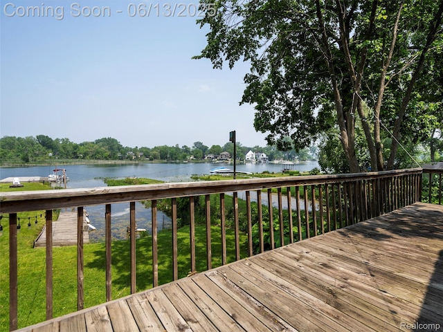 4967 Coshocton Dr, Waterford, MI 48327 - wooden deck featuring a water view and a lawn