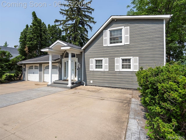 4967 Coshocton Dr, Waterford, MI 48327 - view of front of home with concrete driveway and a garage