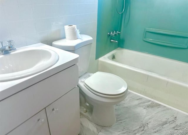 3461 Michael Ave, Warren, MI 48091 - bathroom with marble finish floors, vanity, and washtub / shower combination