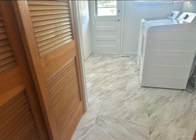 3461 Michael Ave, Warren, MI 48091 - laundry room featuring separate washer and dryer and light marble finish floors