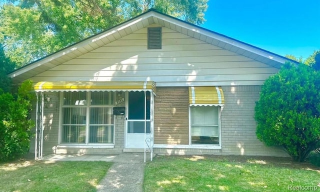 3461 Michael Ave, Warren, MI 48091 - view of front of home with brick siding and a front lawn