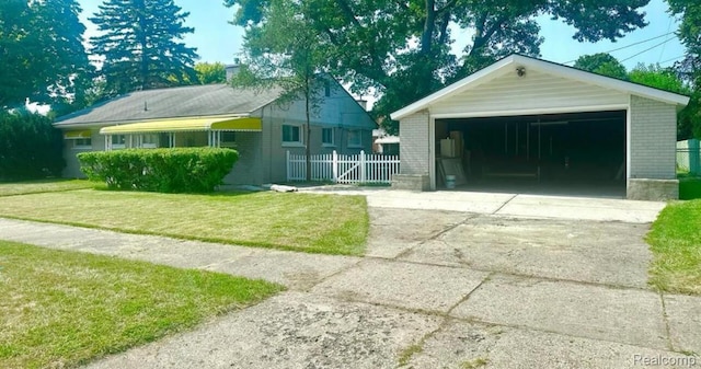 3461 Michael Ave, Warren, MI 48091 - view of front of house featuring a garage, an outbuilding, and brick siding
