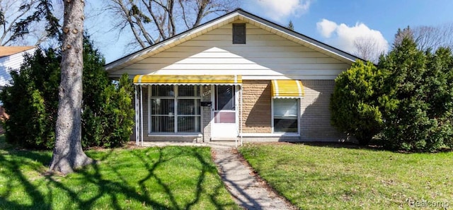 3461 Michael Ave, Warren, MI 48091 - back of property with a lawn and brick siding