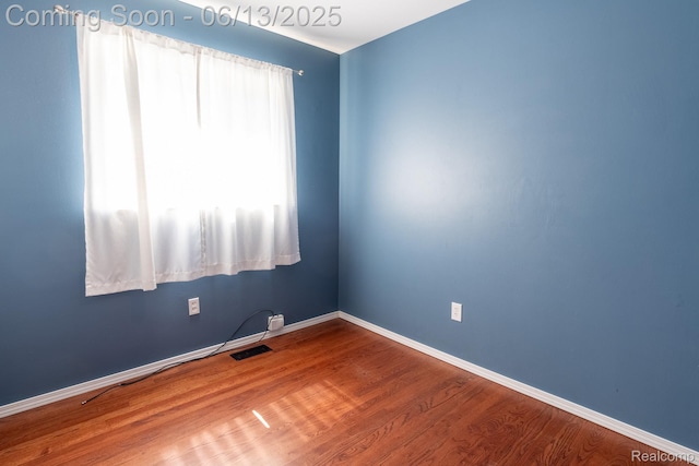 21806 Trombly St, Saint Clair Shores, MI 48080 - spare room featuring wood finished floors and baseboards