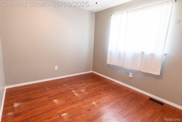 21806 Trombly St, Saint Clair Shores, MI 48080 - unfurnished room with baseboards and wood finished floors