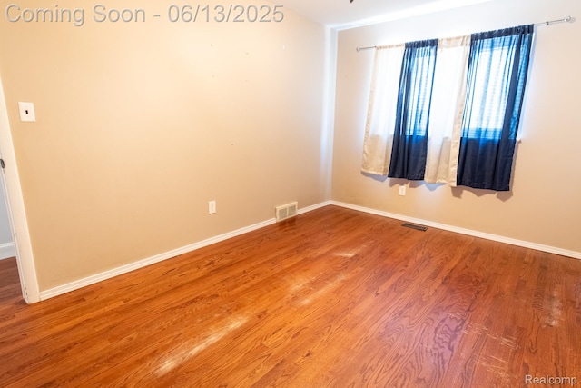 21806 Trombly St, Saint Clair Shores, MI 48080 - spare room with baseboards and wood finished floors