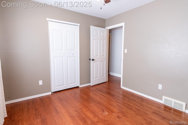 21806 Trombly St, Saint Clair Shores, MI 48080 - unfurnished bedroom featuring wood finished floors, baseboards, and ceiling fan