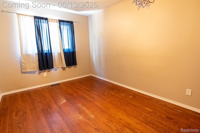 21806 Trombly St, Saint Clair Shores, MI 48080 - spare room featuring wood finished floors and baseboards
