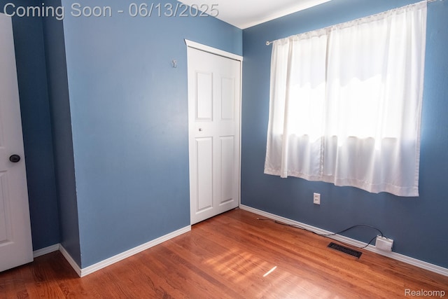21806 Trombly St, Saint Clair Shores, MI 48080 - unfurnished bedroom featuring wood finished floors and baseboards