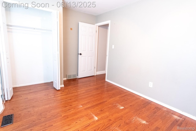 21806 Trombly St, Saint Clair Shores, MI 48080 - unfurnished bedroom featuring light wood-style floors, baseboards, and a closet