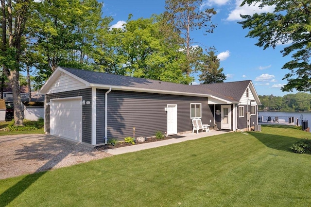 4823 Lakeside Blvd, Hale, MI 48739 - rear view of house featuring a lawn and a water view