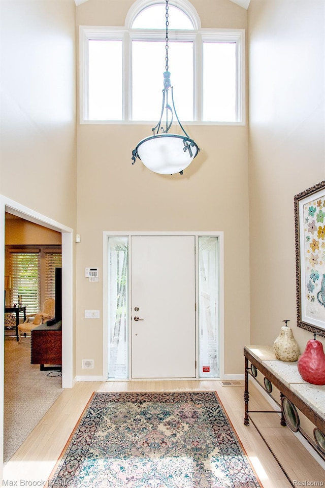 6524 Pleasant Lake Ct, West Bloomfield, MI 48322 - entrance foyer with a high ceiling and light wood finished floors
