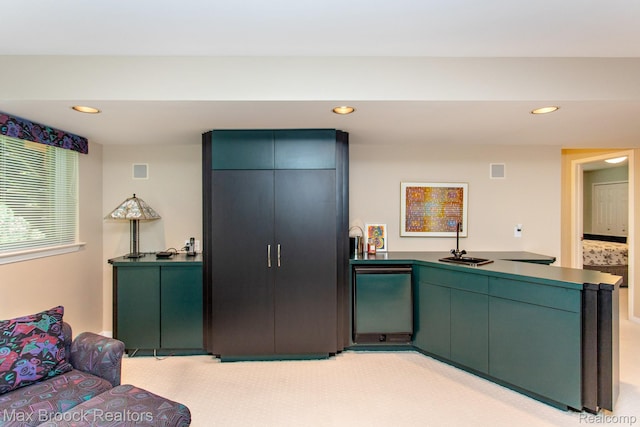6524 Pleasant Lake Ct, West Bloomfield, MI 48322 - kitchen with recessed lighting, a peninsula, dark countertops, and fridge