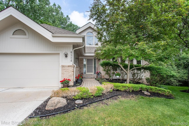 6524 Pleasant Lake Ct, West Bloomfield, MI 48322 - view of front facade featuring brick siding, concrete driveway, a garage, a front yard, and a shingled roof
