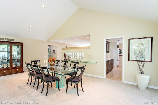 6524 Pleasant Lake Ct, West Bloomfield, MI 48322 - dining area with light colored carpet, high vaulted ceiling, and recessed lighting