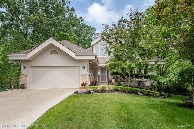 6524 Pleasant Lake Ct, West Bloomfield, MI 48322 - view of front of house featuring a shingled roof, a garage, driveway, a front lawn, and brick siding