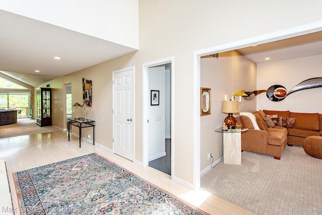 6524 Pleasant Lake Ct, West Bloomfield, MI 48322 - corridor featuring wood finished floors, vaulted ceiling, and recessed lighting
