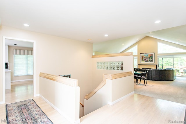 6524 Pleasant Lake Ct, West Bloomfield, MI 48322 - hall with an upstairs landing, light wood-type flooring, recessed lighting, and lofted ceiling