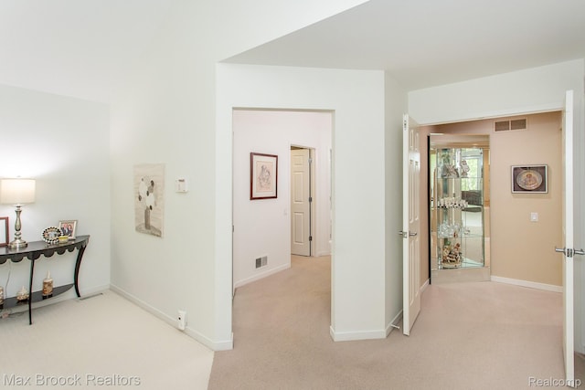 6524 Pleasant Lake Ct, West Bloomfield, MI 48322 - corridor featuring light carpet and baseboards