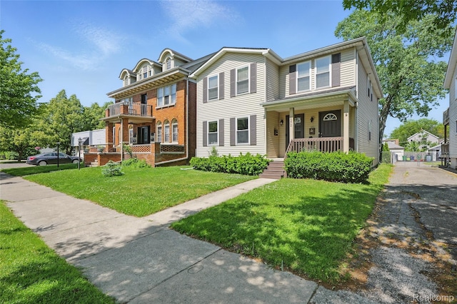 1372 Maryland St, Grosse Pointe, MI 48230 - view of front of house with a porch, a front yard, and brick siding