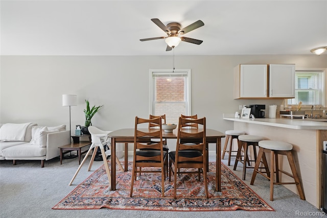 1372 Maryland St, Grosse Pointe, MI 48230 - carpeted dining area featuring a ceiling fan and a sink