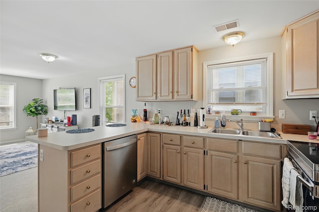 1372 Maryland St, Grosse Pointe, MI 48230 - kitchen featuring appliances with stainless steel finishes, light brown cabinetry, a peninsula, and light countertops