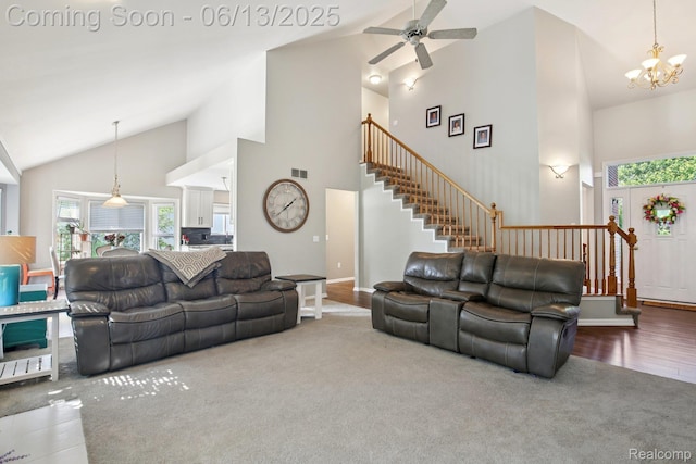 8329 Deer Creek Ct, Grand Blanc, MI 48439 - carpeted living room with stairs, high vaulted ceiling, a ceiling fan, a chandelier, and wood finished floors