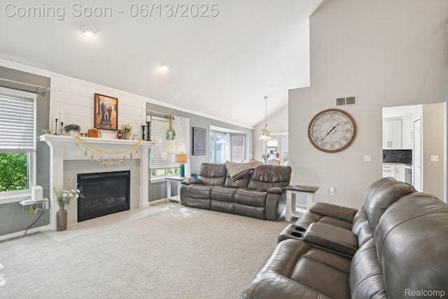 8329 Deer Creek Ct, Grand Blanc, MI 48439 - carpeted living area featuring plenty of natural light, a premium fireplace, high vaulted ceiling, and crown molding