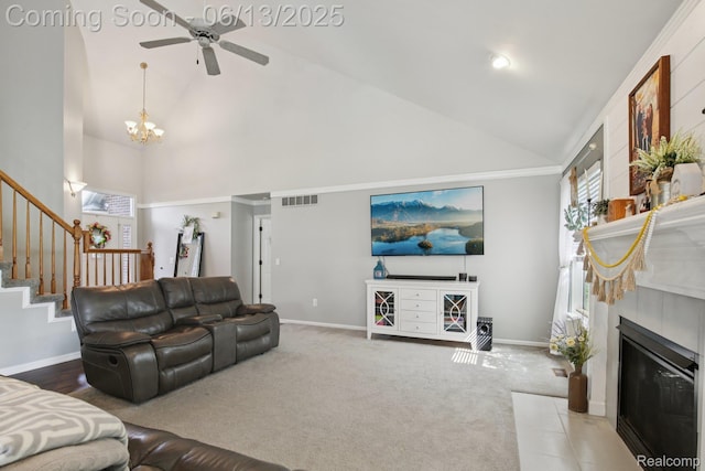 8329 Deer Creek Ct, Grand Blanc, MI 48439 - living room featuring high vaulted ceiling, ceiling fan, a chandelier, a tile fireplace, and stairs