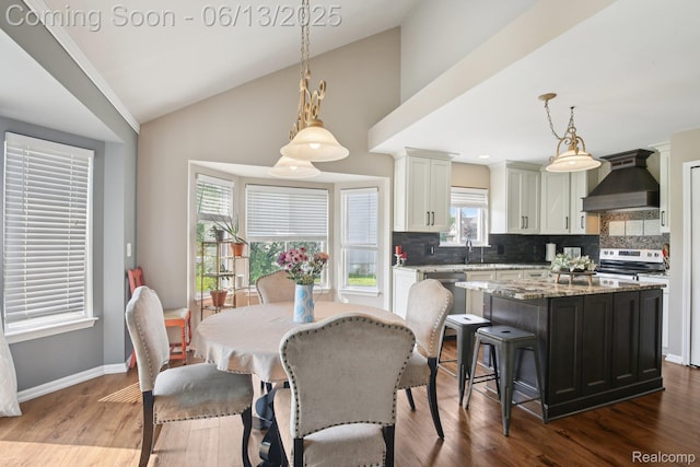 8329 Deer Creek Ct, Grand Blanc, MI 48439 - dining area with dark wood finished floors and lofted ceiling