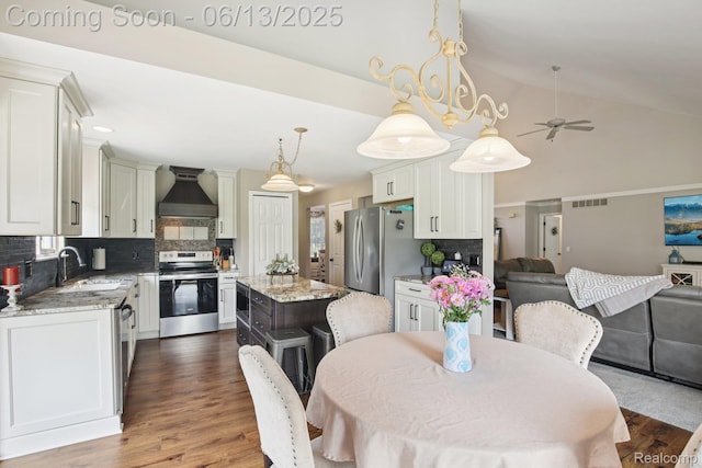 8329 Deer Creek Ct, Grand Blanc, MI 48439 - dining space featuring dark wood-style flooring, lofted ceiling, a ceiling fan, and recessed lighting