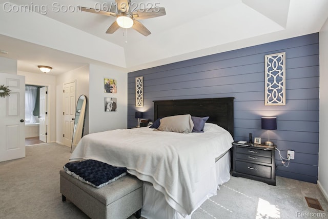 8329 Deer Creek Ct, Grand Blanc, MI 48439 - bedroom featuring light carpet, a raised ceiling, a ceiling fan, and wood walls
