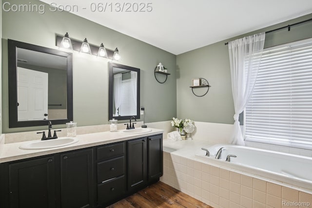 8329 Deer Creek Ct, Grand Blanc, MI 48439 - bathroom featuring double vanity, wood finished floors, and a bath