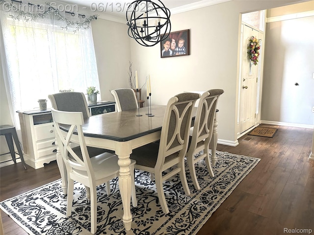 8329 Deer Creek Ct, Grand Blanc, MI 48439 - dining space featuring crown molding, dark wood-style floors, and a chandelier