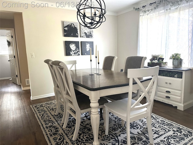 8329 Deer Creek Ct, Grand Blanc, MI 48439 - dining area with healthy amount of natural light, a chandelier, dark wood-type flooring, and crown molding