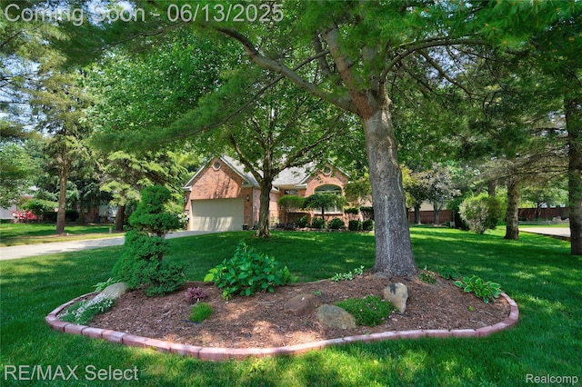 16483 Dawnlight Dr, Fenton, MI 48430 - view of front of property featuring a front yard, brick siding, and a garage