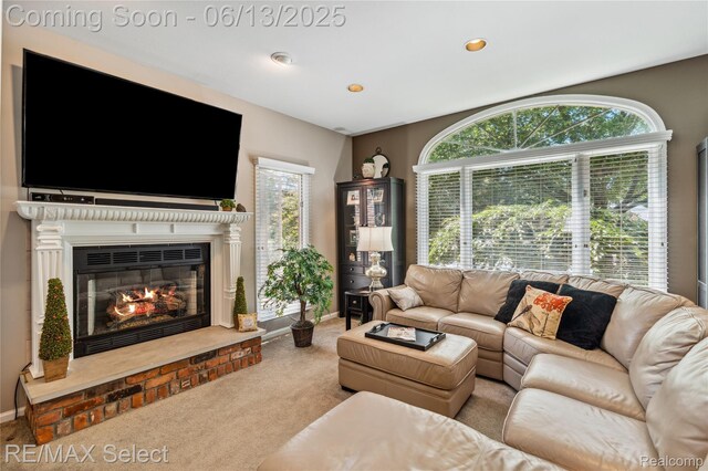 16483 Dawnlight Dr, Fenton, MI 48430 - carpeted living area with a glass covered fireplace and recessed lighting