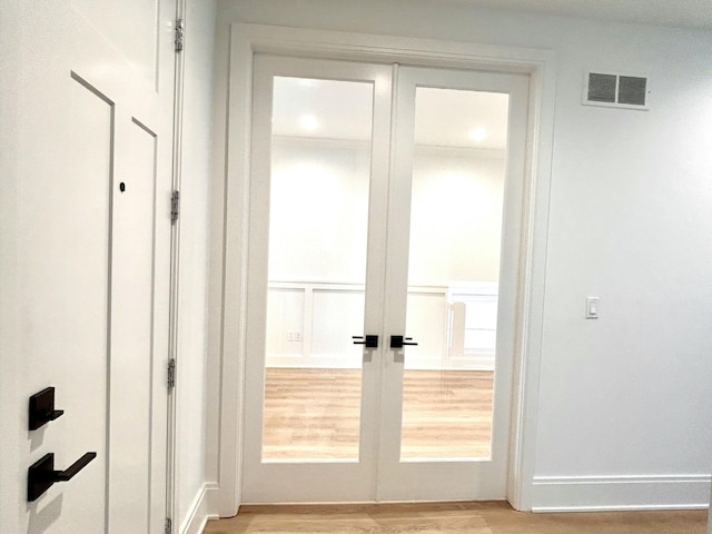 1439 Bennaville Ave, Birmingham, MI 48009 - doorway with light wood finished floors and french doors