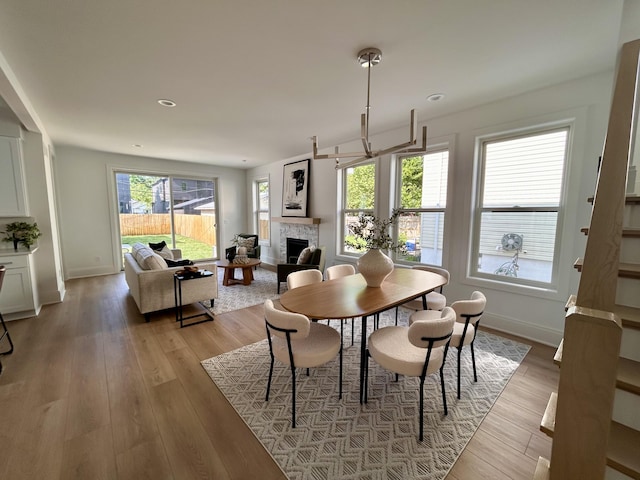 1439 Bennaville Ave, Birmingham, MI 48009 - dining space featuring a fireplace, light wood finished floors, and recessed lighting