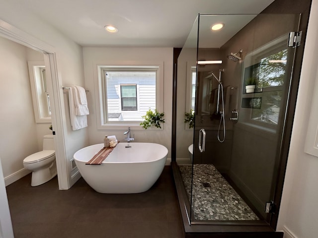 1439 Bennaville Ave, Birmingham, MI 48009 - full bathroom featuring a shower stall, plenty of natural light, a freestanding bath, tile patterned flooring, and recessed lighting