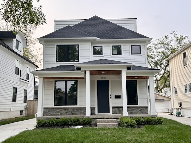 1439 Bennaville Ave, Birmingham, MI 48009 - view of front facade with a porch, a shingled roof, stone siding, and a detached garage