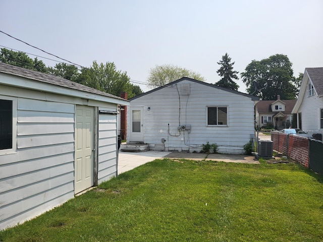 27837 Kaufman St, Roseville, MI 48066 - rear view of property with central AC, an outbuilding, and a patio