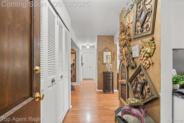 27557 W Echo Vly Unit 153, Farmington Hills, MI 48334 - hallway with light wood-style flooring and baseboards