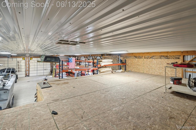 2970 Sand Beach Rd, Bad Axe, MI 48413 - garage with a workshop area
