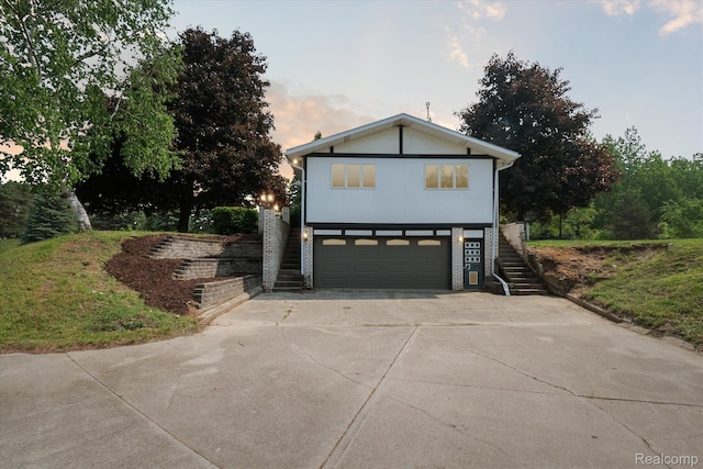 2970 Sand Beach Rd, Bad Axe, MI 48413 - view of front of property featuring stairway, a garage, and driveway