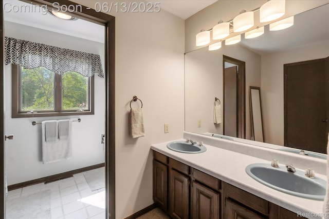 2970 Sand Beach Rd, Bad Axe, MI 48413 - bathroom featuring double vanity and baseboards