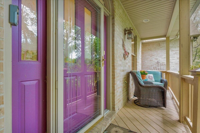 2082 Blackberry Ln, Howell, MI 48855 - view of exterior entry featuring covered porch and brick siding