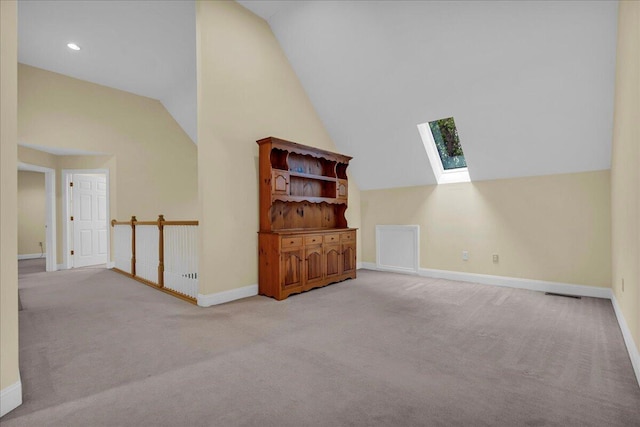 2082 Blackberry Ln, Howell, MI 48855 - bonus room with a skylight, vaulted ceiling, carpet floors, baseboards, and recessed lighting